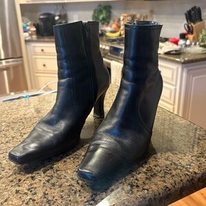 Sleek Black Leather Heeled Boots